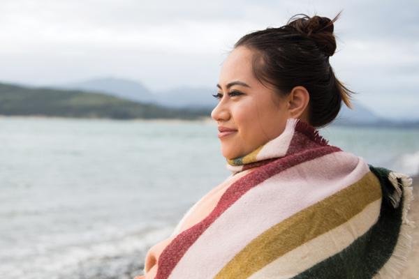 Woman looking across a lake