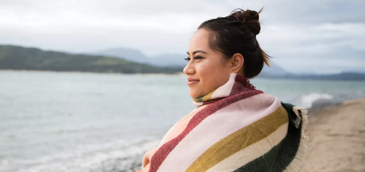 Woman looking across a lake